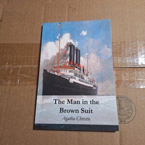 the man in the brown suit